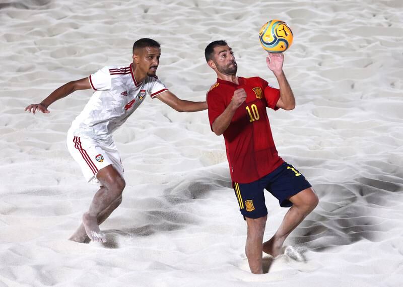 Waleed Salem, left, of the UAE marks Antonio Hernandez of Spain during their group match. Getty