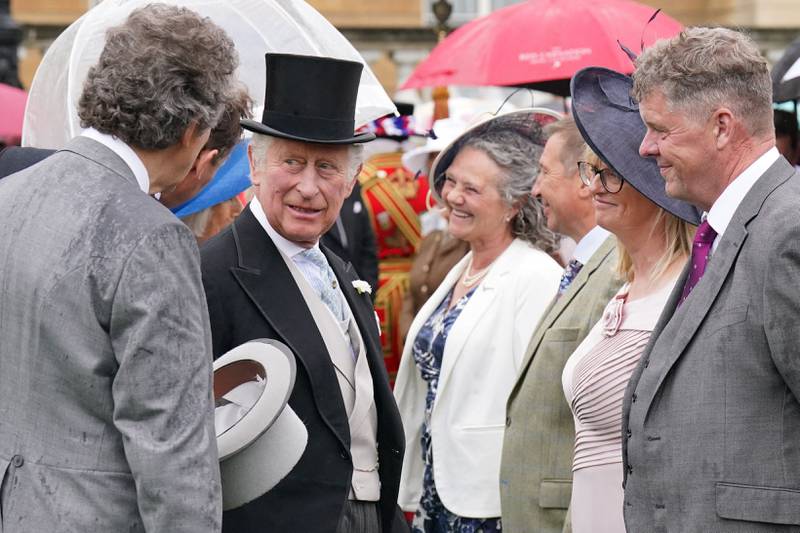 Prince Charles meets guests during the Royal Garden Party. AFP