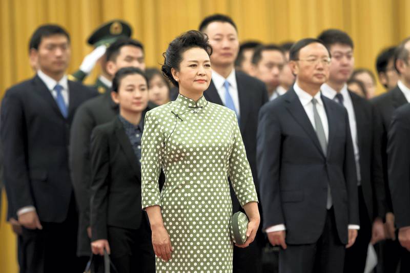 BEIJING, CHINA - JANUARY 09:  First Lady Peng Liyuan loos on during a welcoming ceremony inside the Great Hall of the People on January 9, 2018 in Beijing, China.  (Photo by Lintao Zhang/Getty Images)