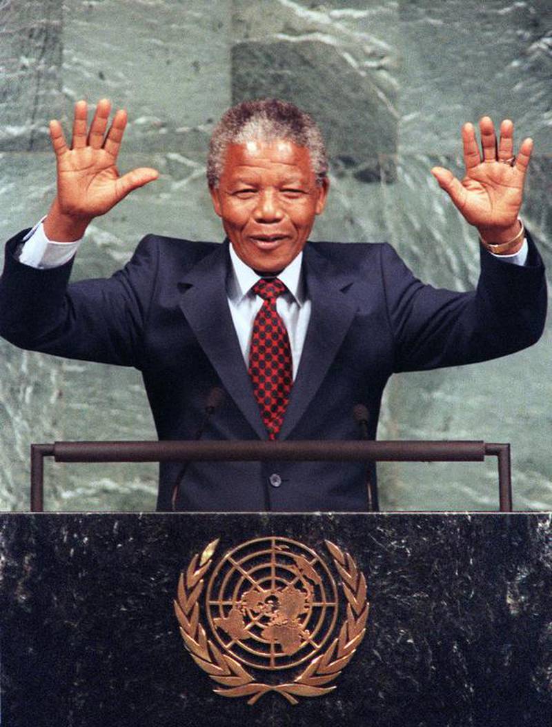 June 22, 1990: Mandela in New York, raising his arms over his head as he receives applause at the United Nations. Mandela urged the UN to maintain sanctions against South Africa until apartheid is abolished. AFP