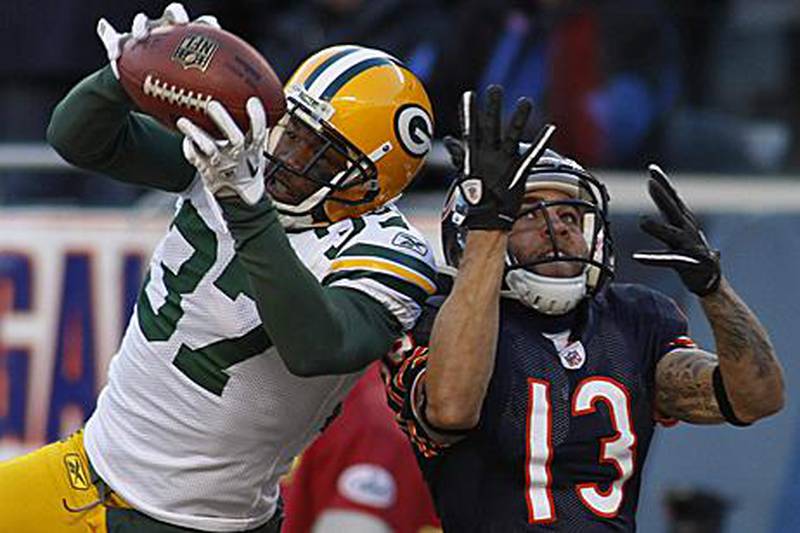 Green Bay Packers' cornerback Sam Shields, left, intercepts a ball intended for the Chicago Bears wide receiver Johnny Knox.