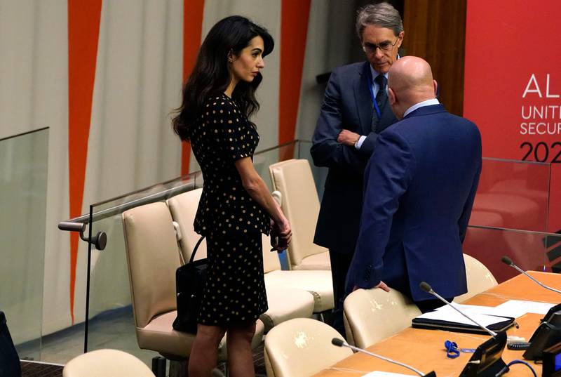 Ms Clooney speaks to others at the informal Security Council session. AFP