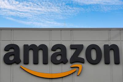 FILE PHOTO: The Amazon logo is seen outside its JFK8 distribution center in Staten Island, New York, U.S. November 25, 2020.  REUTERS/Brendan McDermid./File Photo