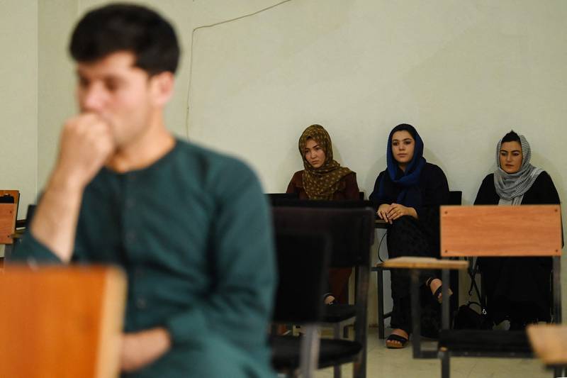 Students return to class after private universities reopened in Kabul. AFP