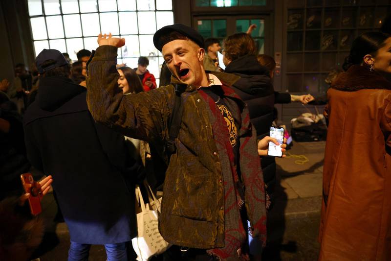 People party on a street in Soho last night before the tier 3 measures came in. Reuters