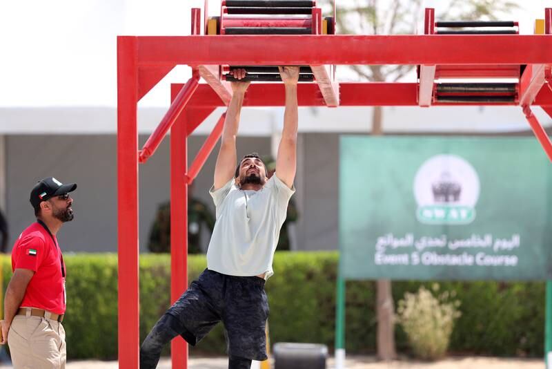 A Sharjah officer contends with the monkey bars