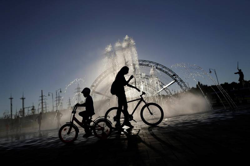 Children stand in front of the water fountains on a hot day in Volgograd. Ueslei Marcelino / Reuters