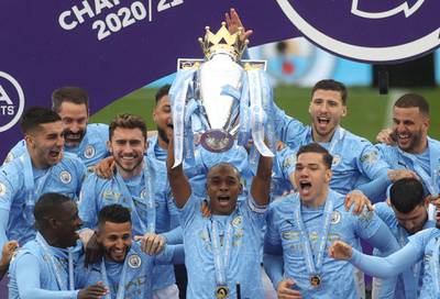 Manchester City's Fernandinho lifts the Premier League trophy at the Etihad Stadium on Sunday. Reuters