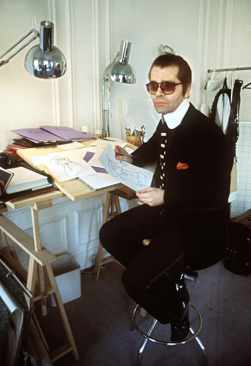 German fashion designer Karl Lagerfeld sits at his desk in 1979. Also known as "King Karl", he is one of the most successful fashion designers of the 20th century. | usage worldwide Photo by: Roland Witschel/picture-alliance/dpa/AP Images