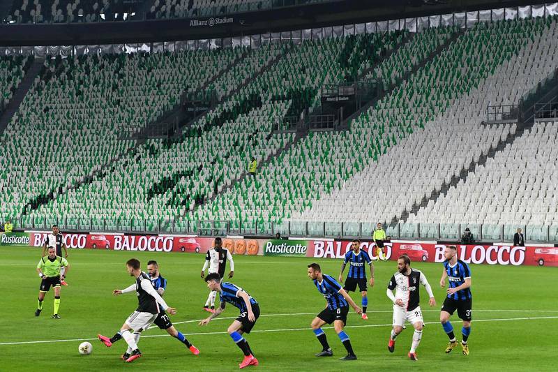 Inter Milan and Juventus players compete in an empty stadium during the Serie A match in Turin. AFP
