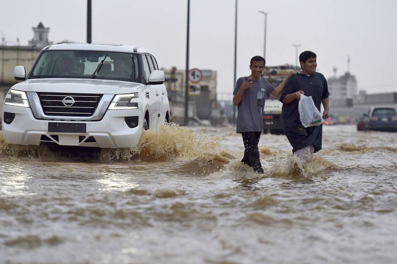 A motorist drives through the water. The road to Makkah, Islam's holiest city, was closed. AFP