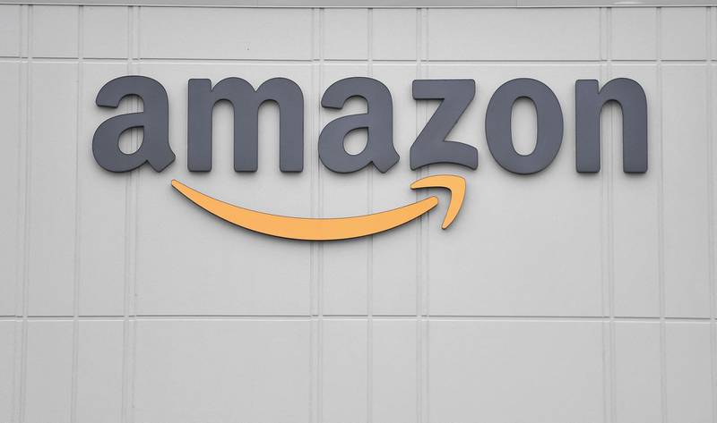 (FILES) In this file photo the logo of US online retail giant Amazon is seen at the distribution center in Staten Island on March 30, 2020 in New York. The attorney general for the US capital city Washington sued Amazon on May 25, 2021 on antitrust grounds, claiming the tech giant abuses its dominant position in online retail sales. The suit filed by the office of Attorney General Karl Racine alleges that Amazon's control of 50 to 70 percent of US e-commerce sales results in higher consumer prices. / AFP / Angela Weiss

