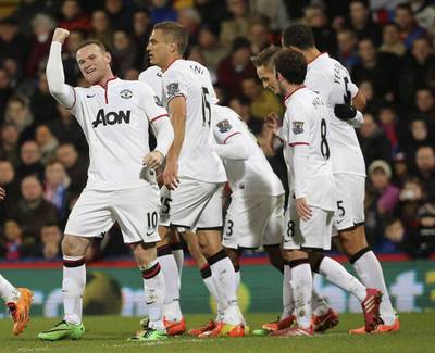 Manchester United's Wayne Rooney, left, celebrates with teammates after scoring against Crystal Palace during their English Premier League soccer match at Selhurst Park in London on February 22, 2014. REUTERS/Paul Hackett
