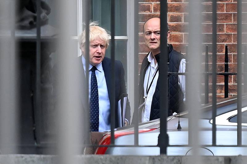 (FILES) In this file photo taken on September 03, 2019 Britain's Prime Minister Boris Johnson (L) and his special advisor Dominic Cummings leave from the rear of Downing Street in central London, before heading to the Houses of Parliament. British Prime Minister Boris Johnson faced growing scrutiny on April 25, 2021, following explosive accusations by his former chief aide Dominic Cummings earlier this week that he lacks competence and integrity. / AFP / DANIEL LEAL-OLIVAS
