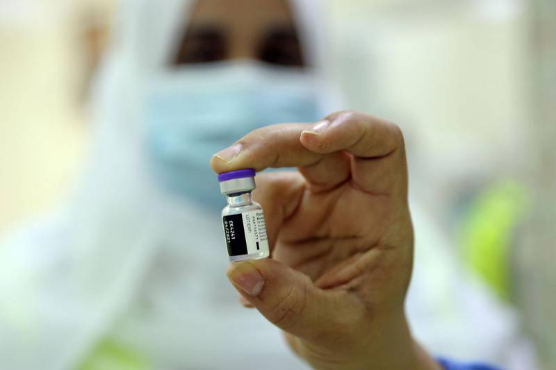 A healthcare worker prepares to administer the Pfizer-BioNTech Covid-19 vaccine in the Omani capital Muscat.  AFP