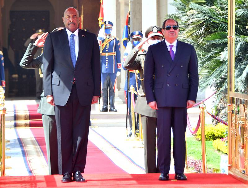 Sudan's military ruler Gen Abdel Fattah Al Burhan with Egyptian President Abdel Fattah El Sisi, right, during a visit to Cairo on March 30. AFP 