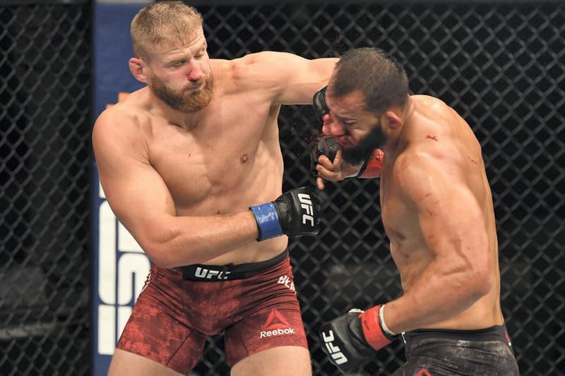 ABU DHABI, UNITED ARAB EMIRATES - SEPTEMBER 27:  (L-R) Jan Blachowicz of Poland punches Dominick Reyes in their light heavyweight championship bout during UFC 253 inside Flash Forum on UFC Fight Island on September 27, 2020 in Abu Dhabi, United Arab Emirates. (Photo by Josh Hedges/Zuffa LLC)