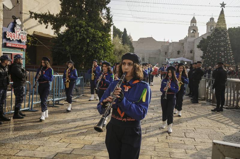 Girl Scouts march during a Christmas parade in Bethlehem's Manger Square on Christmas Eve. AP Photo