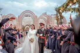 Jordan's Crown Prince Hussein and Saudi Rajwa Alseif walk during their wedding ceremonies in Amman, Jordan, Thursday, June 1, 2023.  (Royal Hashemite Court via AP)