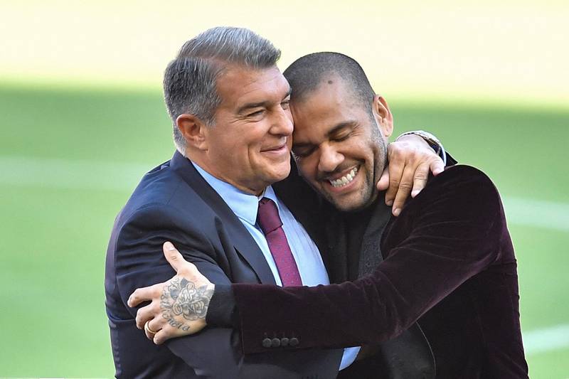 Dani Alves and Barcelona president Joan Laporta during the defender's presentation ceremony at the Camp Nou after rejoining the club on November 17, 2021. AFP