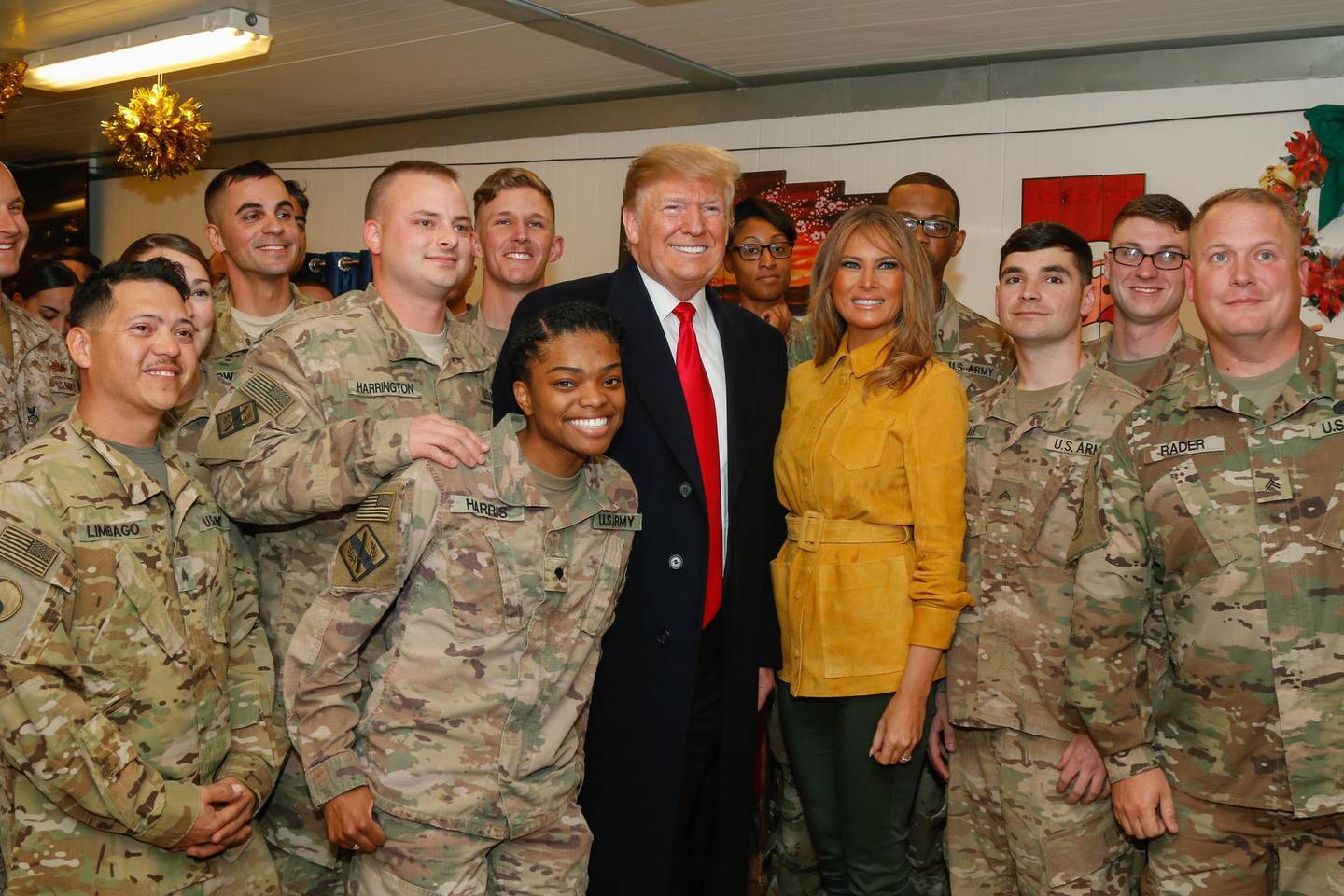 epa08112488 (FILE) - A handout photo made available by the US Army shows US President Donald J. Trump (C-L) and first lady Melania Trump (C-R) posing for a photo with service members assigned to Combined Joint Task Force – Operation Inherent Resolve (CJTF-OIR) during a troop visit to Al Asad Air Base, Iraq, 26 December 2018 (reissued 08 January 2020). According to Iranian state TV on 08 January 2020, Iran's Revolutionary Guard Crops (IRGC) launched a series of rockets targeting al Asad air base, one of the bases hosting US military troops in Iraq. The attack comes days after top Iranian General Qasem Soleimani, head of the IRGC's Quds force, was killed by a US drone strike in Baghdad.  EPA/Leland White / US ARMY HANDOUT  HANDOUT EDITORIAL USE ONLY/NO SALES
