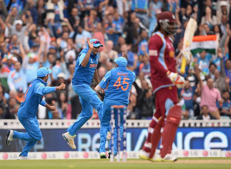 LONDON, ENGLAND - JUNE 11:  Ravichandran Ashwin of India celebrates with Rohit Sharma after taking the catch to dismiss Chris Gayle of the West Indies during the ICC Champions Trophy Group B match between India and West Indies  at The Kia Oval on June 11, 2013 in London, England.  (Photo by Mike Hewitt/Getty Images) *** Local Caption ***  170322368.jpg