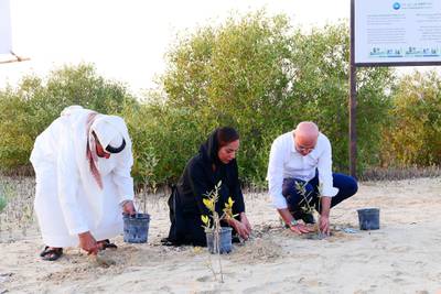 DUBAI, UNITED ARAB EMIRATES , April 19  – 2021 :- Left to Right – Major Ali Al Suwaidi, Hiba Obaid Al Shehhi, Acting Director Of Biodiversity Department and  Omar Channawi, CEO, Procter and Gamble Middle East FZE planting during the inauguration of Dubai Mangroves Forest at the Jebel Ali Wildlife Sanctuary, held under the patronage of Her Highness Sheikha Manal bint Mohammed bin Rashid Al Maktoum, President of Dubai Women Establishment and Honorary President of EMEG.  ( Pawan Singh / The National ) For News/Online/Instagram/Standalone/Big Picture. Story by Ramola