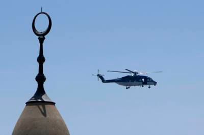 A Saudi police helicopter patrols over Namira Mosque in Arafat. AP Photo