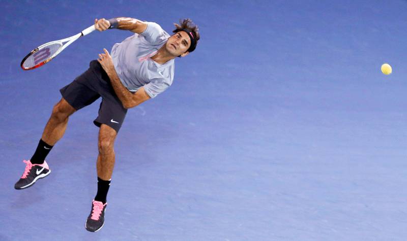 Roger Federer of Switzerland serves to Marcel Granollers of Spain during their men's singles match at the ATP Dubai Tennis Championships, February 27, 2013. REUTERS/Jumana El Heloueh (UNITED ARAB EMIRATES - Tags: SPORT TENNIS) *** Local Caption ***  DUB17_TENNIS-MEN-DU_0227_11.JPG