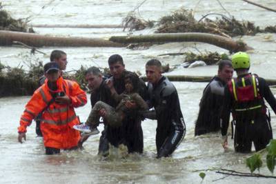 A girl is rescued during floods at a campsite in Kirklareli province, Turkey. AP