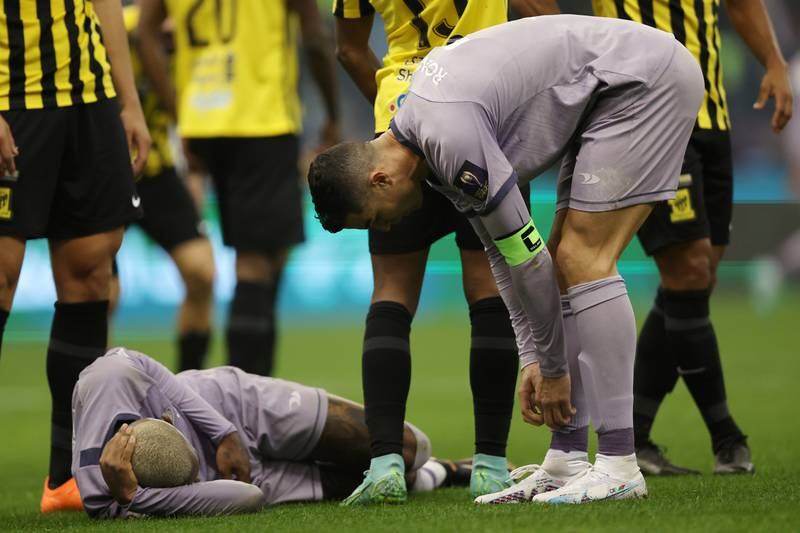 Cristiano Ronaldo of Al Nassr checks on teammate Talisca. Getty Images