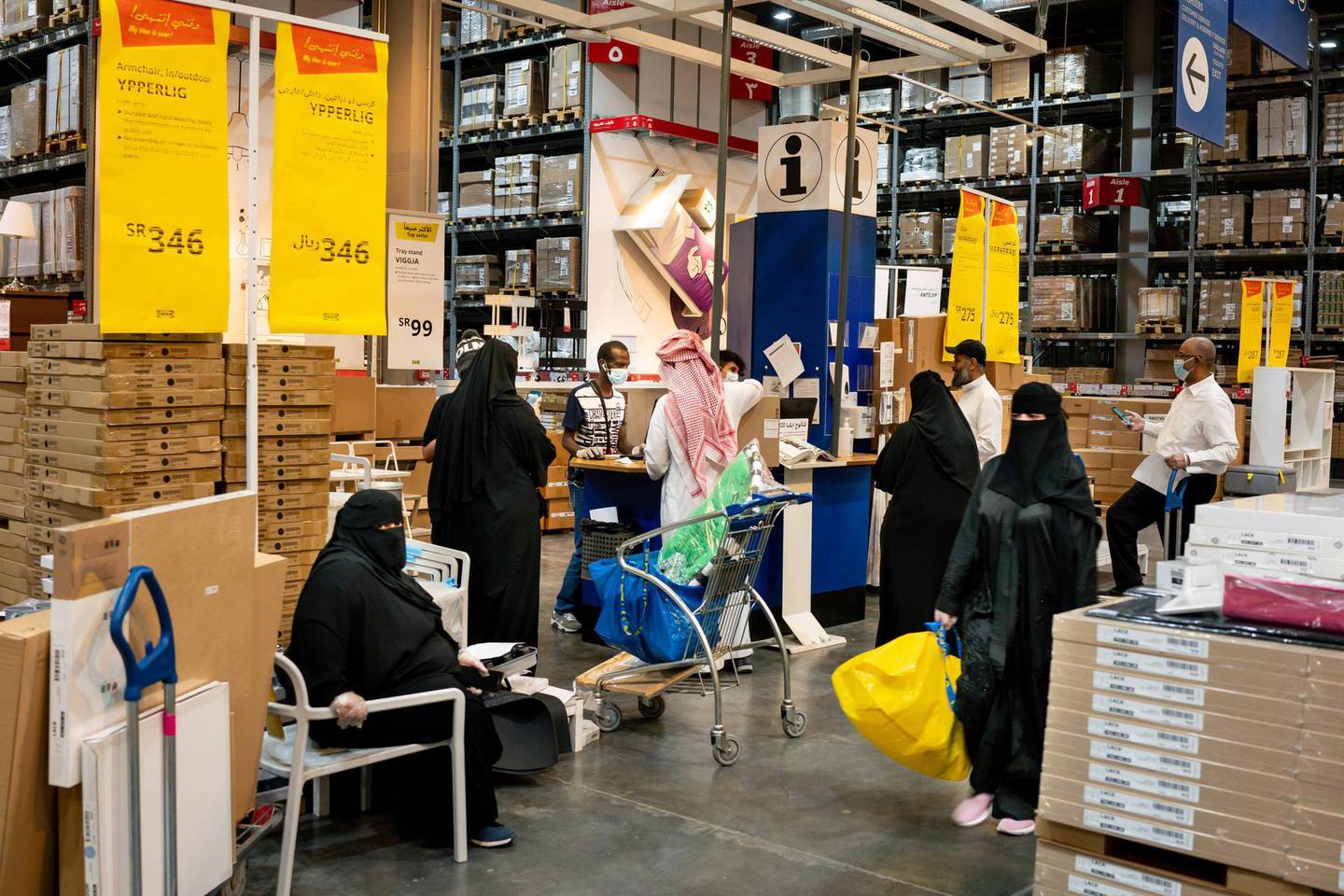 Customers wear protective face masks while shopping in an Ikea AB store in Riyadh, Saudi Arabia, on Tuesday, May 19. 2020. Before the pandemic, most shops, pharmacies and gas stations in the kingdom halted for at least 30 minutes for each prayer session, the only country that enforced such closures. Photographer: Tasneem Alsultan/Bloomberg