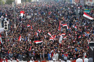 FILE - In this Friday, March 24, 2017 file photo, followers of Shiite cleric Muqtada al-Sadr chant slogans demanding government reform during a demonstration at Tahrir square in Baghdad, Iraq. In early October 2019, social media users began sharing a falsely captioned photo from this event claiming to depict recent protests in Iraq. The country has been embroiled in anti-government clashes for the past week as protesters demand jobs, improved services and an end to corruption. (AP Photo/Karim Kadim)