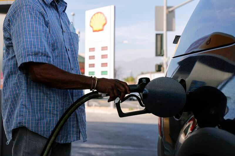 A man refuels his car at a Shell gas station in Los Angeles, California. EPA