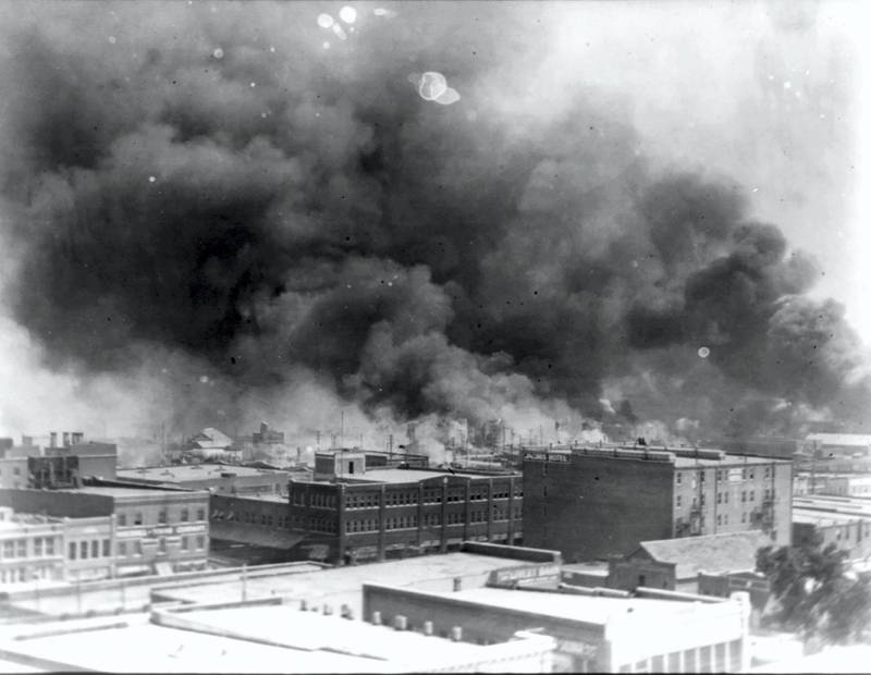 Smoke rises from buildings during the race massacre in Tulsa, Oklahoma, U.S. in 1921.     Alvin C. Krupnick Co./National Association for the Advancement of Colored People (NAACP) Records/Library of Congress via REUTERS. NO RESALES. NO ARCHIVES. THIS IMAGE HAS BEEN SUPPLIED BY A THIRD PARTY.