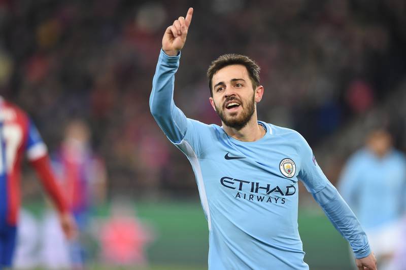 Manchester City's Portuguese midfielder Bernardo Silva celebrates after scoring a goal during the UEFA Champions League round of 16 first leg football match between Basel and Manchester City at the Saint Jakob-Park Stadium in Basel on February 13, 2018. / AFP PHOTO / SEBASTIEN BOZON