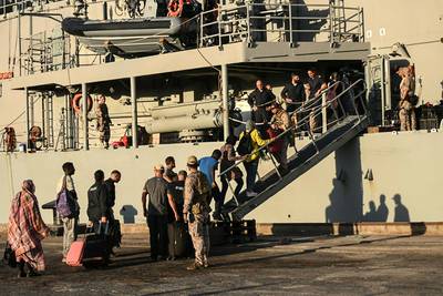People board the Spanish frigate Reina Sofia during an evacuation from Port Sudan to Saudi Arabia. AFP