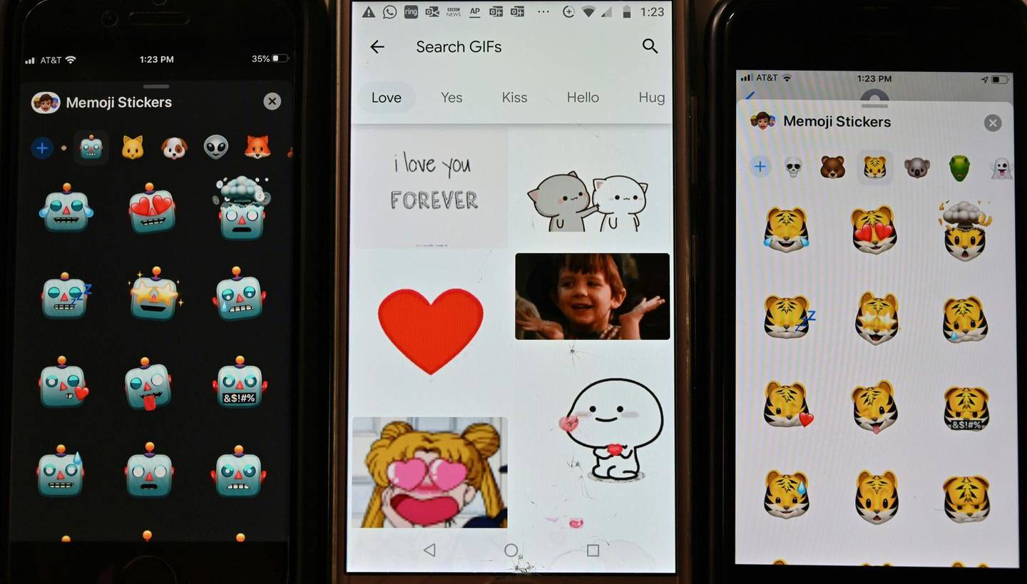 This photo illustration shows a selection of emojis and stickers displayed on smart phones in Washington, DC on December 19, 2019.  Researchers from the University of North Carolina at Chapel Hill and the Max Planck Institute for the Science of Human History have used a new tool in comparative linguistics to examine emotional concepts across the world, finding the way we think of things like anger, fear, and joy depends on our language. Their study drew on data from nearly 2,500 languages, including large ones with millions of speakers to small ones with thousands, and was published in the journal Science on December 19, 2019.  / AFP / EVA HAMBACH
