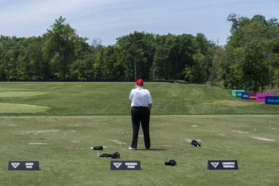 Mr Trump talks on the driving range before the second round of the LIV Golf at Trump National Golf Club. AP