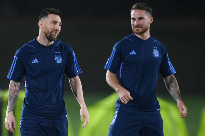 Lionel Messi and midfielder Alexis Mac Allister take part in a training session at Qatar University. AFP