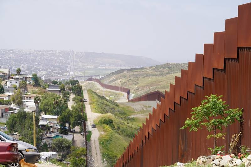 The controversial US border fence stretches for kilometres near Tijuana.