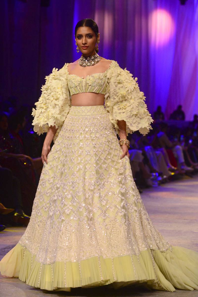 A model walks for Manish Malhotra's 2022 Mijwan Welfare Society fashion show. AFP