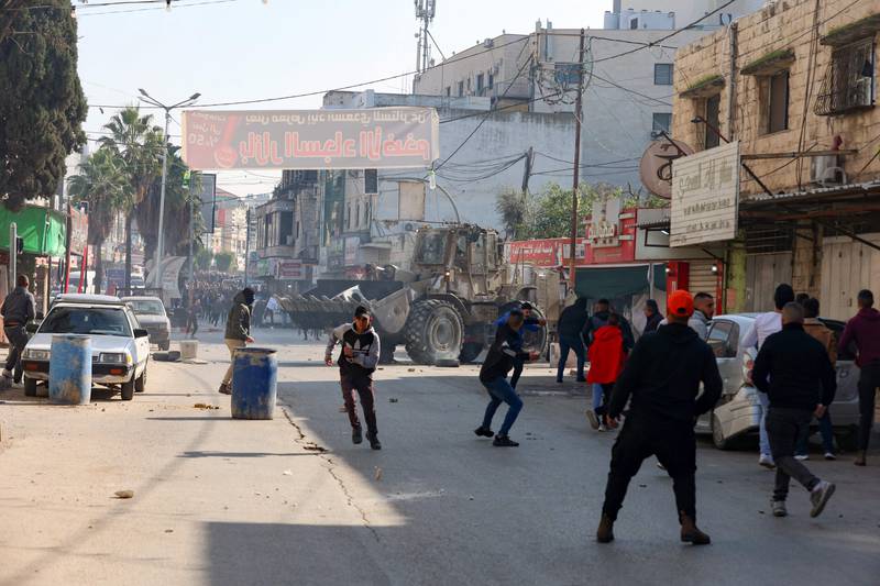 Palestinians in Jenin confront Israeli forces. AFP