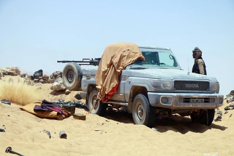 A fighter loyal to Yemen's Saudi-backed government takes position during the fight against Houthi militiamen in the northeastern province of Marib. EPA