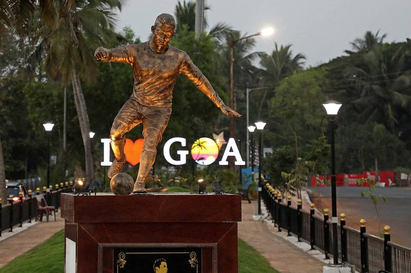 This photograph taken on December 30, 2021 shows a newly installed statue of Portuguese footballer Cristiano Ronaldo in Calangute after the statue has caused a stir, this time in Goa, the southern Indian state that was a Portuguese colony until 60 years ago.  (Photo by AFP)
