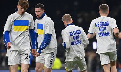 Everton players wear T-shirts in support of Ukraine as they warm up for an English Premier League football match against Tottenham Hotspur. AP