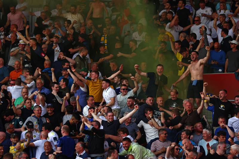 Leeds fans celebrate but the goal was subsequently disallowed for offside. AFP