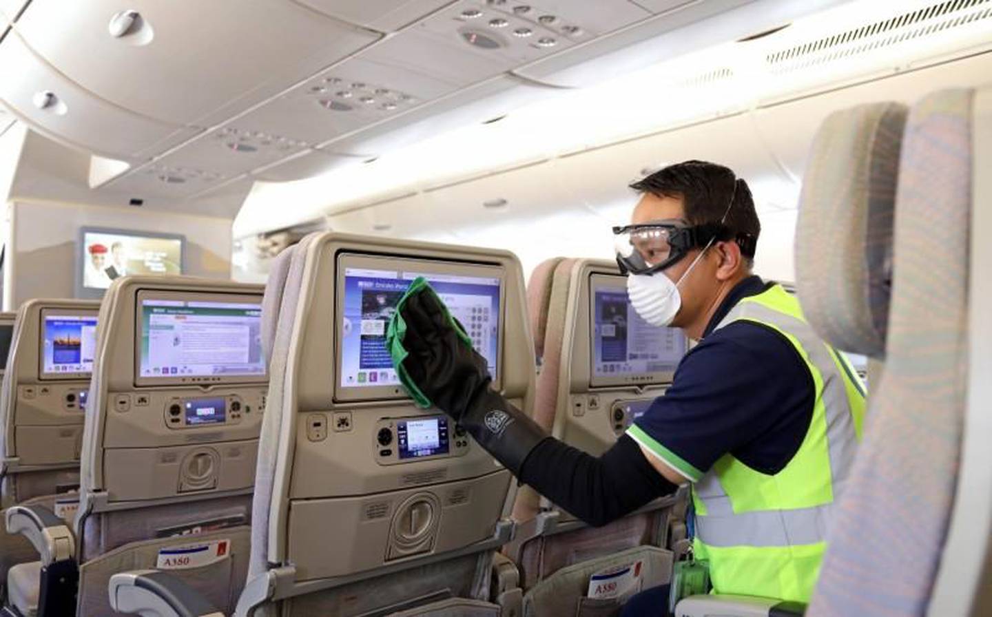 Travellers flying on Emirates repatriation flights must wear gloves and face masks and abide by social distancing rules at the airport and in-flight. Courtesy Emirates 