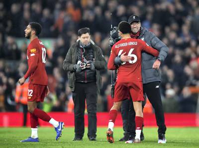 LIVERPOOL, ENGLAND - DECEMBER 29: Jurgen Klopp, Manager of Liverpool and Trent Alexander-Arnold of Liverpool during the Premier League match between Liverpool FC and Wolverhampton Wanderers at Anfield on December 29, 2019 in Liverpool, United Kingdom. (Photo by Clive Brunskill/Getty Images)