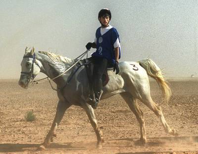 Hamdan bin Mohammed al-Maktum, son of equestrian endurance champion Dubai Crown Prince Sheikh Mohammed bin Rashid al-Maktum, rides his horse during an Equestrian Endurance Championship in Palmyra, 190 km northeast of Damascus, 01 May 2000. (Photo by LOUAI BESHARA / AFP)